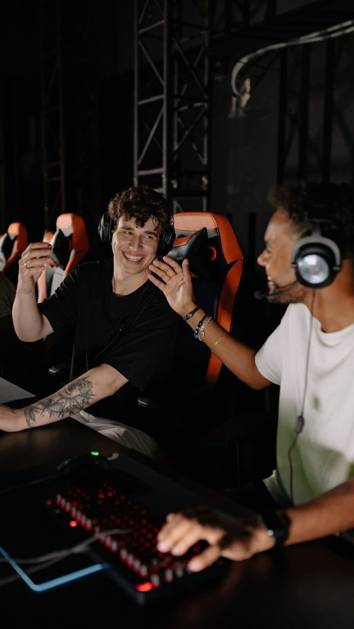 Demo clip: two streamers with headsets laughing, reframed to 9:16